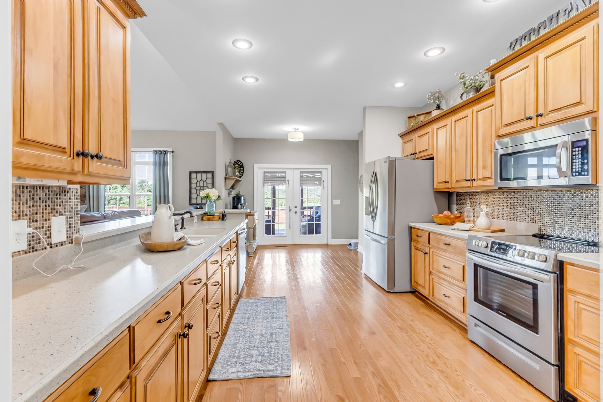 226 Ranch Road Portland, TN 37148 - Photo 13 of 54 a kitchen with stainless steel appliances a stove top oven a sink a refrigerator and cabinets