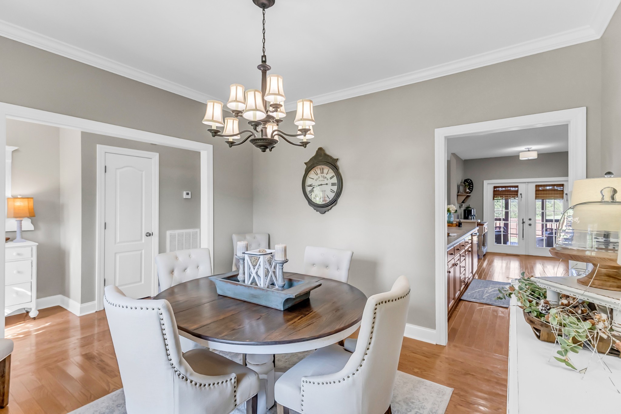 226 Ranch Road Portland, TN 37148 - Photo 21 of 54 a view of a dining room with furniture a chandelier and wooden floor