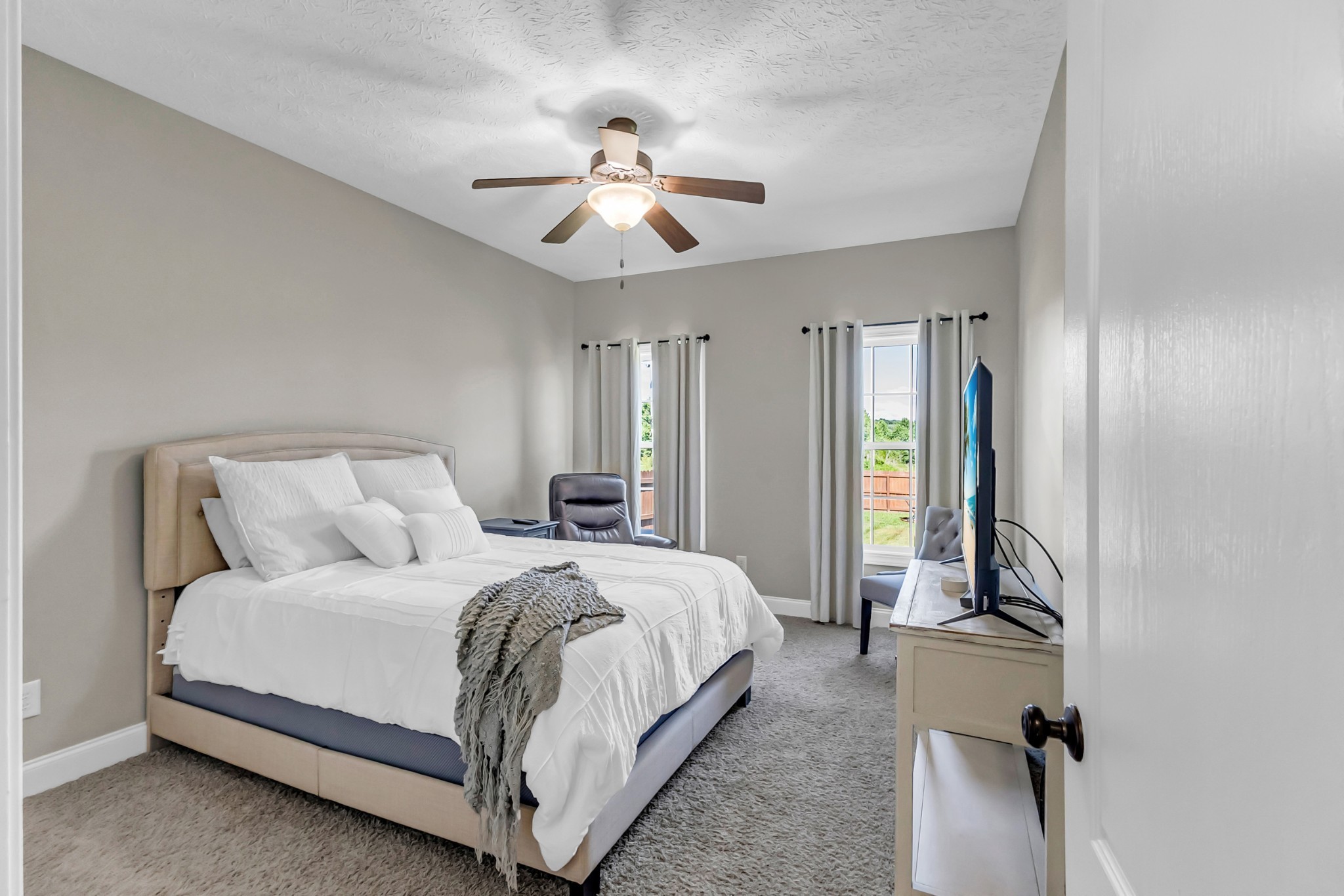 226 Ranch Road Portland, TN 37148 - Photo 35 of 54 a spacious bedroom with a bed and ceiling fan