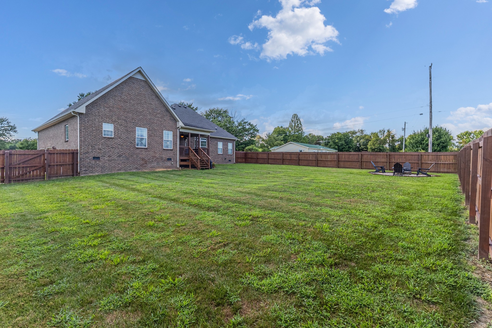 226 Ranch Road Portland, TN 37148 - Photo 44 of 54 a view of a house with a yard and a garden