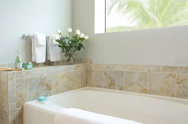 a white bath tub sitting in a bathroom