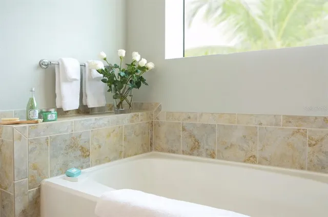 a white bath tub sitting in a bathroom