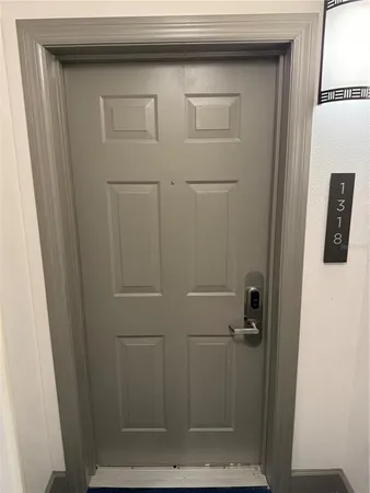 a bathroom with a glass shower door