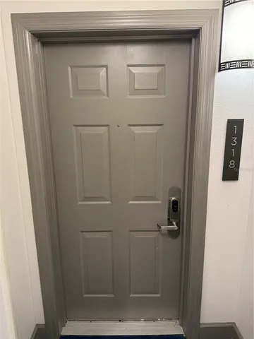 a bathroom with a glass shower door
