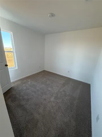 a view of empty room with windows