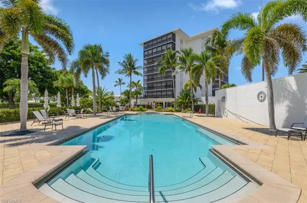 a view of swimming pool with outdoor seating