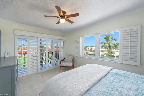 a bathroom with a granite countertop sink a toilet and shower