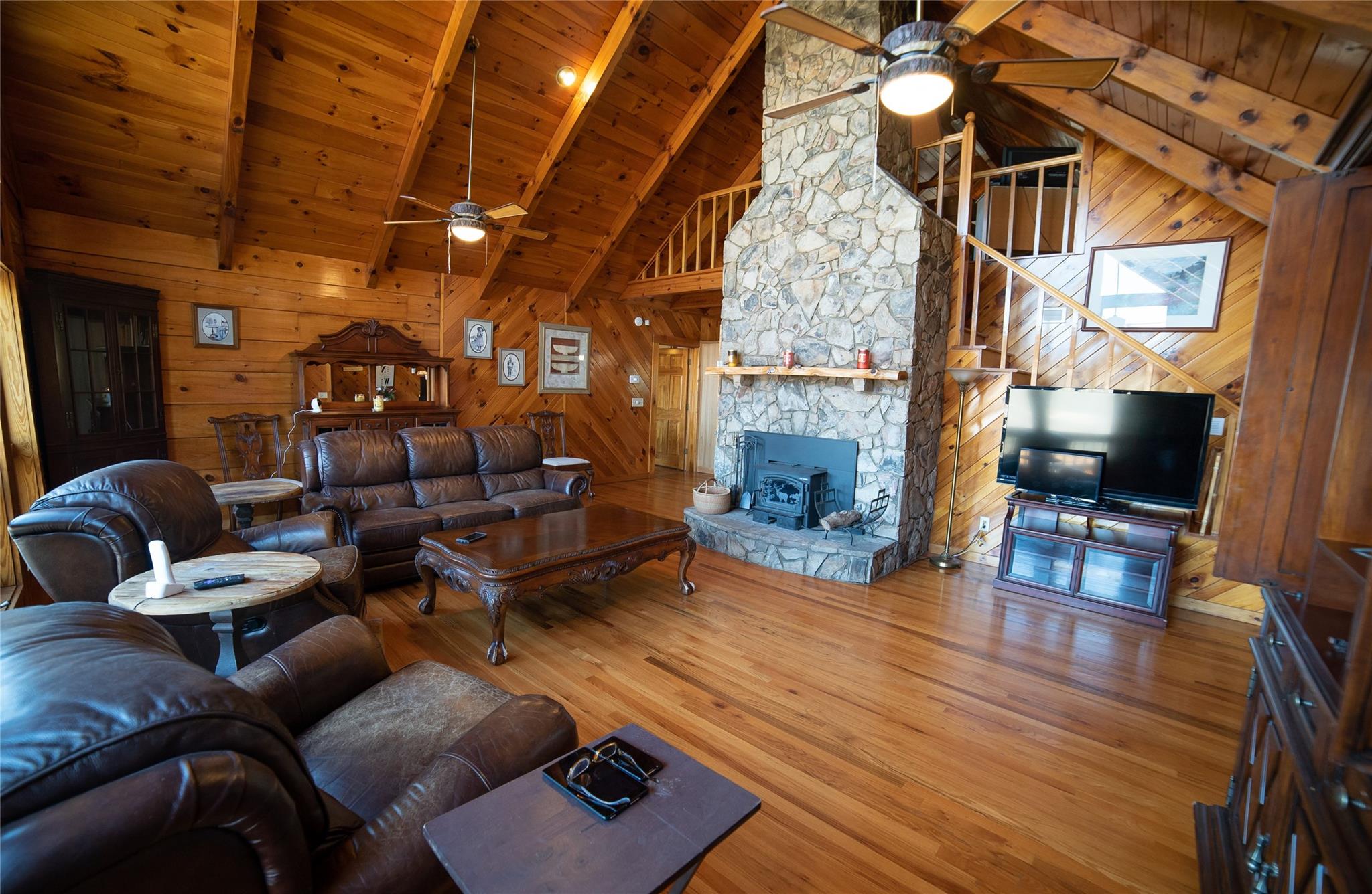 2525 Winkler Way Road Lenoir, NC 28645 - Photo 11 of 47 a living room with furniture a fireplace and a flat screen tv