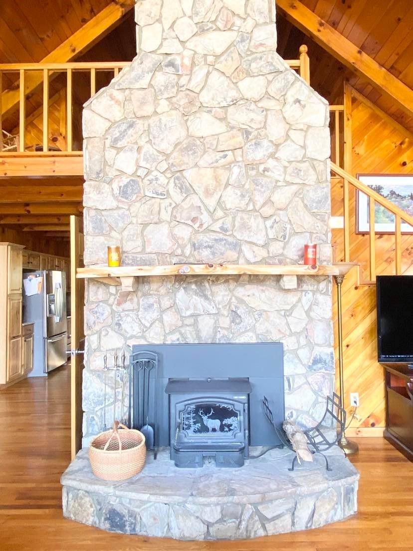 2525 Winkler Way Road Lenoir, NC 28645 - Photo 14 of 47 a living room with a fireplace and a flat screen tv