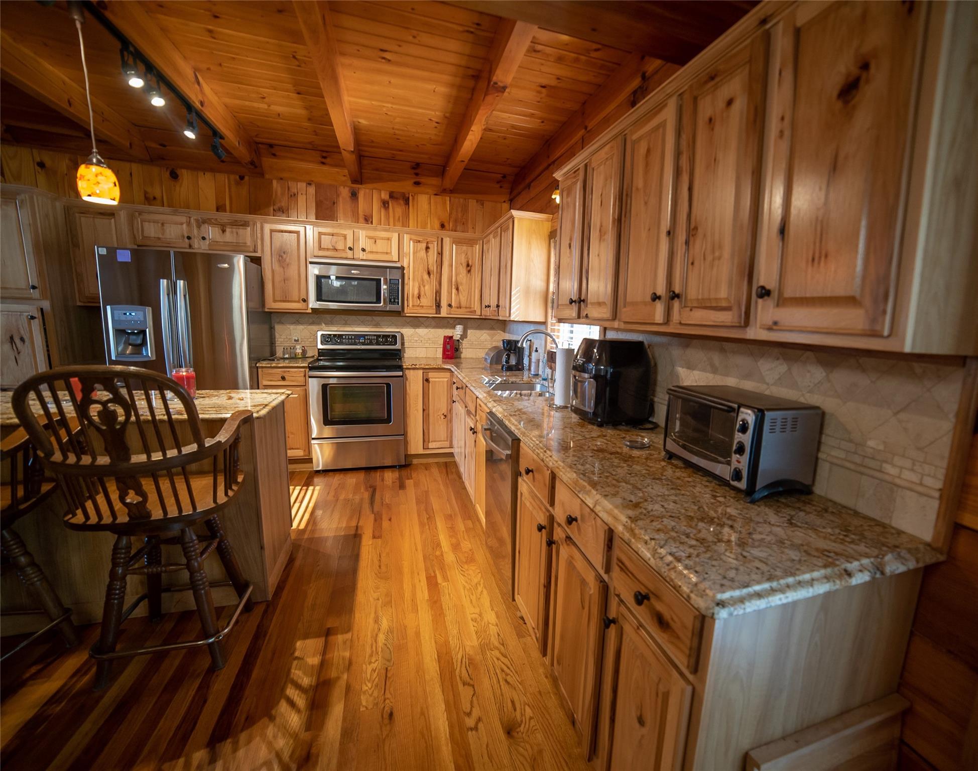 2525 Winkler Way Road Lenoir, NC 28645 - Photo 22 of 47 a kitchen with stainless steel appliances granite countertop a stove a sink and a microwave