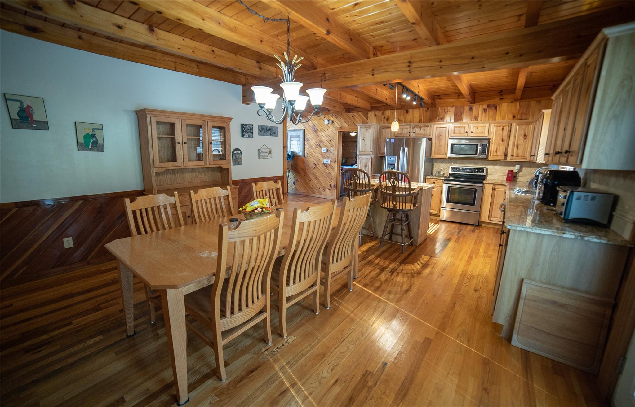 2525 Winkler Way Road Lenoir, NC 28645 - Photo 23 of 47 a view of a dining room with furniture and wooden floor