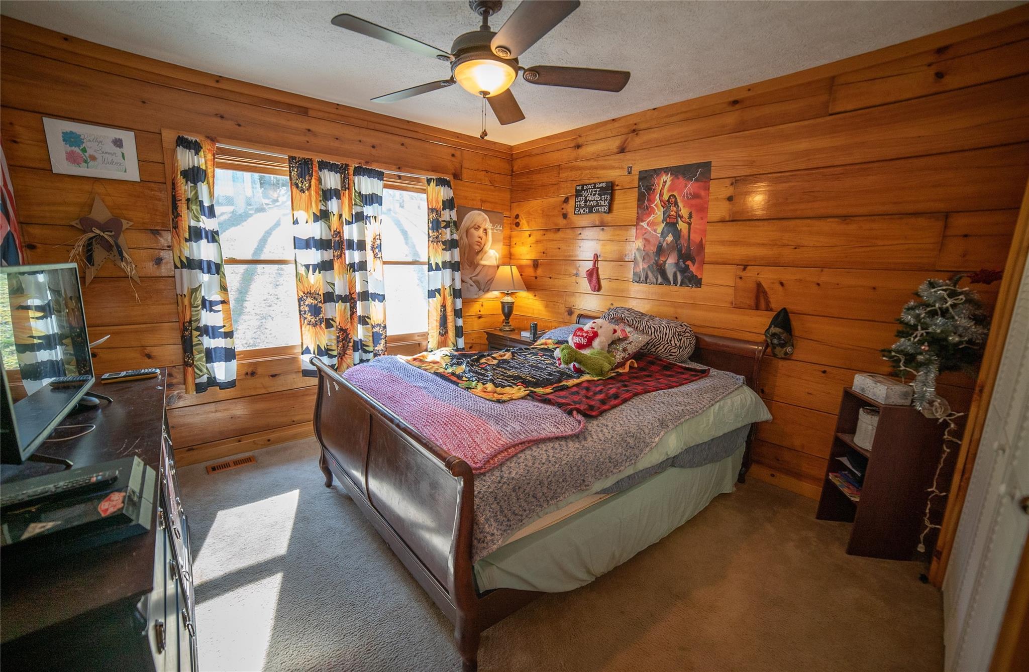 2525 Winkler Way Road Lenoir, NC 28645 - Photo 29 of 47 a bed room with a bed and a chandelier