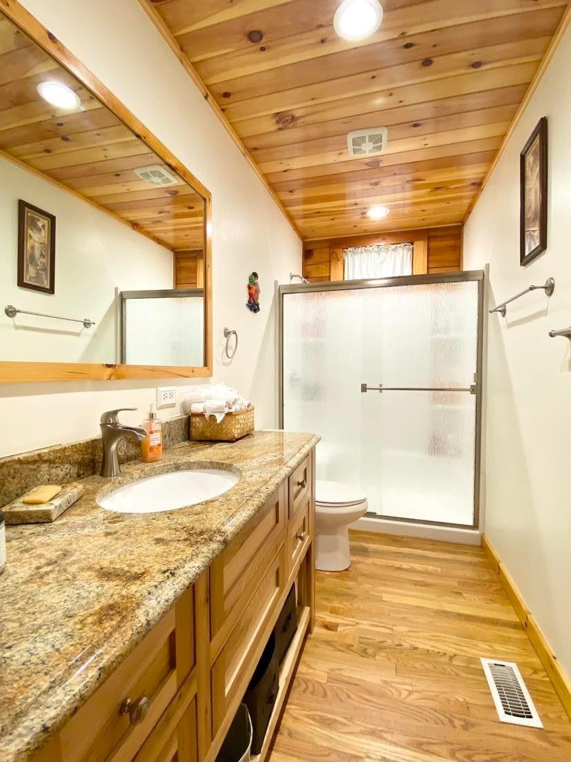 2525 Winkler Way Road Lenoir, NC 28645 - Photo 30 of 47 a bathroom with a granite countertop sink and a shower