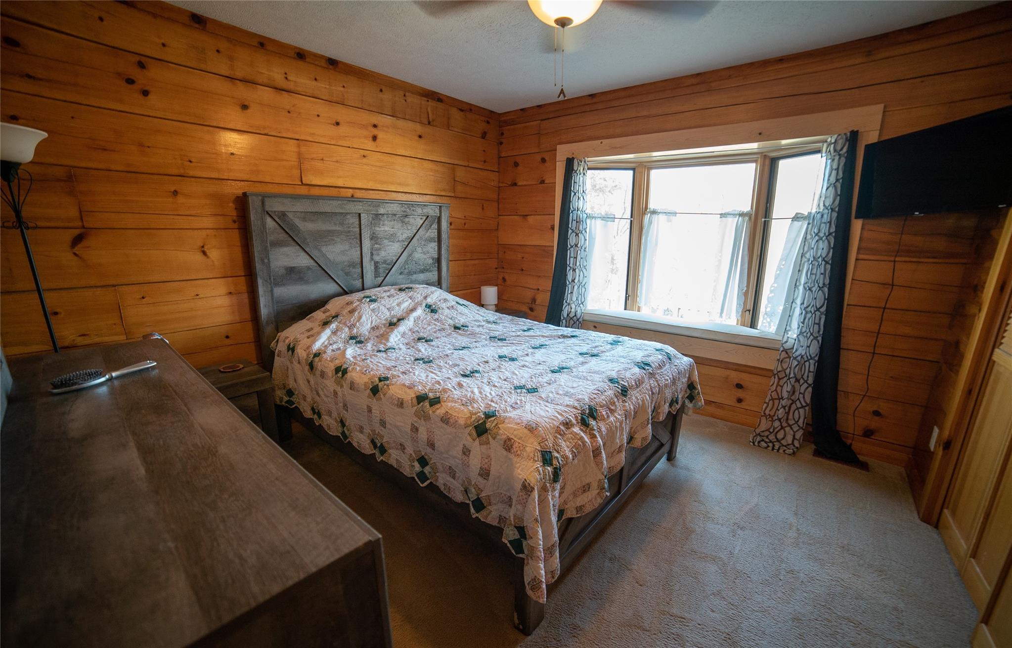 2525 Winkler Way Road Lenoir, NC 28645 - Photo 31 of 47 a bed sitting in a bedroom next to a window