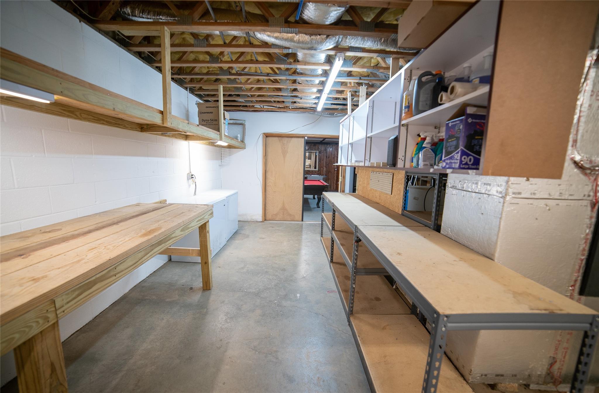 2525 Winkler Way Road Lenoir, NC 28645 - Photo 38 of 47 a storage room with wooden floor and furniture