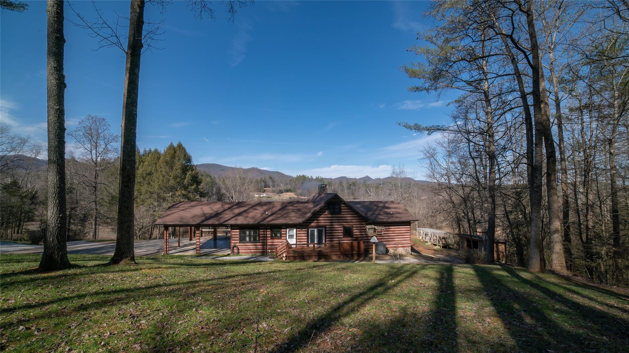 2525 Winkler Way Road Lenoir, NC 28645 - Photo 44 of 47 a view of a big house with a big yard and large trees