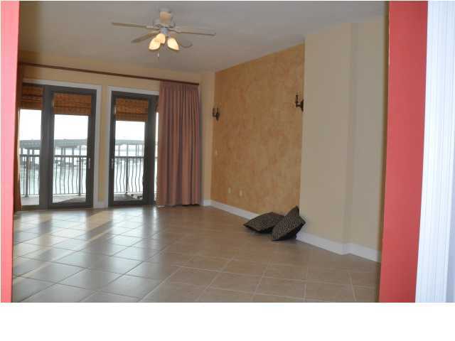 5 Calhoun Avenue, Unit 407 Destin, FL 32541 - Photo 12 of 27 a room with gym equipment and a large window