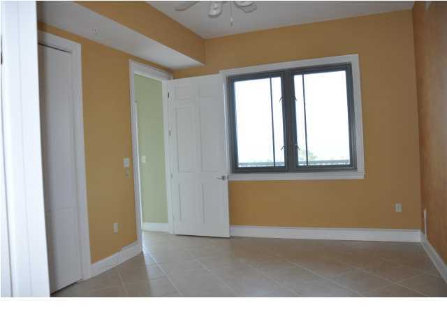 5 Calhoun Avenue, Unit 407 Destin, FL 32541 - Photo 18 of 27 a room with a window and wooden floor