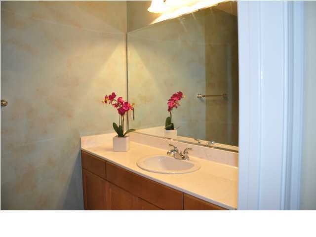 5 Calhoun Avenue, Unit 407 Destin, FL 32541 - Photo 20 of 27 a bathroom with a sink and a mirror