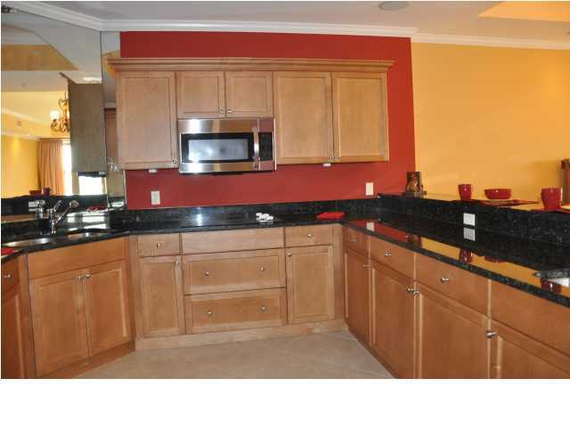 5 Calhoun Avenue, Unit 407 Destin, FL 32541 - Photo 2 of 27 a kitchen with sink and cabinets