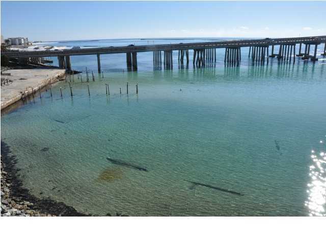 5 Calhoun Avenue, Unit 407 Destin, FL 32541 - Photo 26 of 27 a black and white photo of a lake