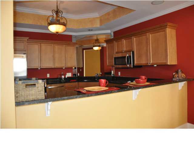 5 Calhoun Avenue, Unit 407 Destin, FL 32541 - Photo 3 of 27 a kitchen with a sink appliances and cabinets