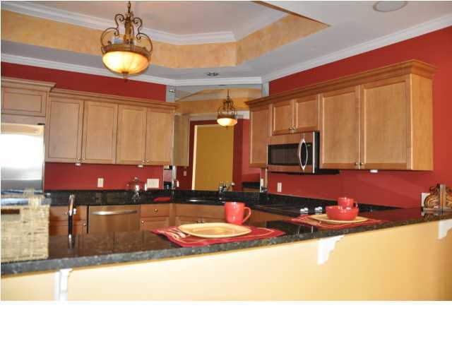 5 Calhoun Avenue, Unit 407 Destin, FL 32541 - Photo 5 of 27 a kitchen with counter top space a sink and appliances