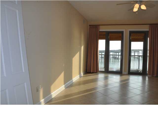 5 Calhoun Avenue, Unit 407 Destin, FL 32541 - Photo 10 of 27 a view interior of a house with wooden floor and windows