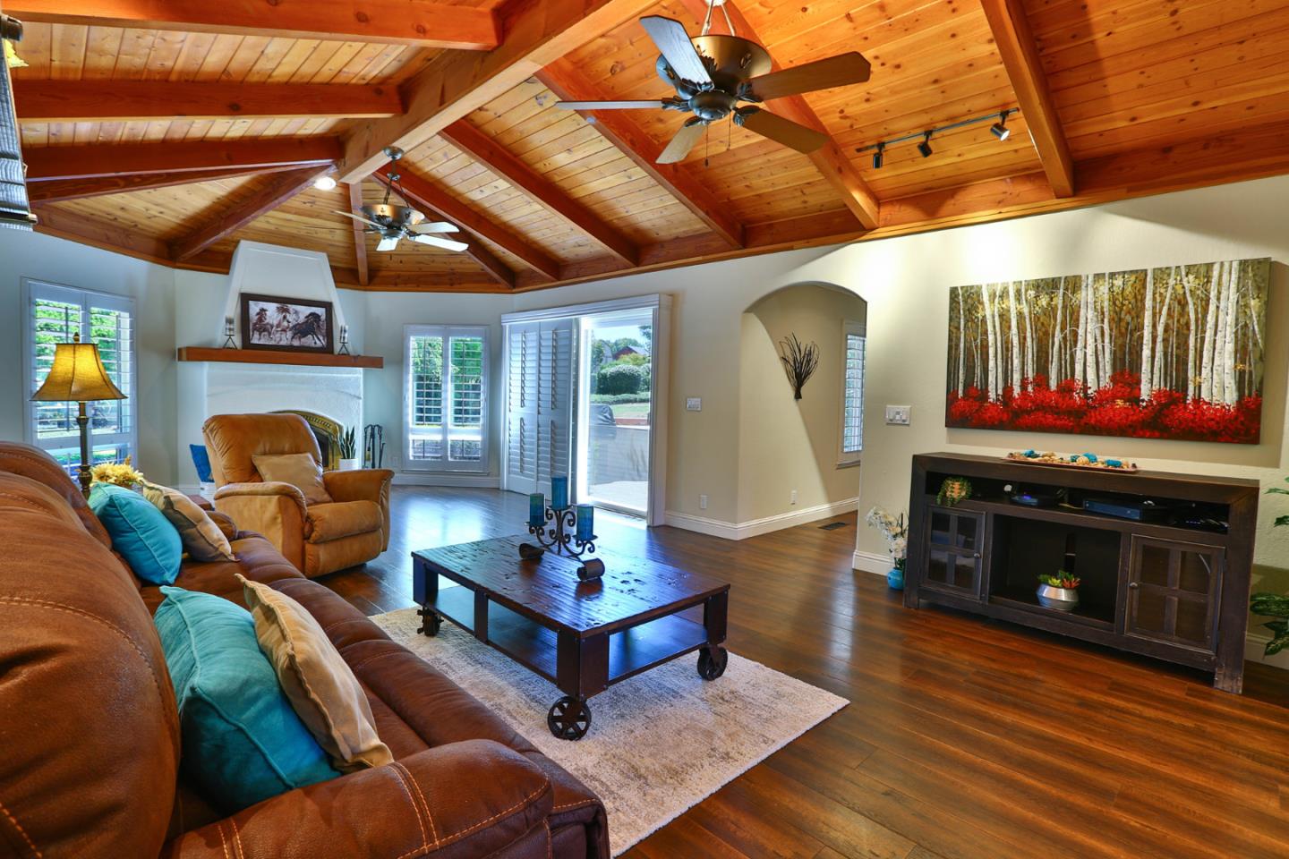 2000 Day Road Gilroy, CA 95020 - Photo 11 of 51 a living room with furniture a fireplace and a flat screen tv