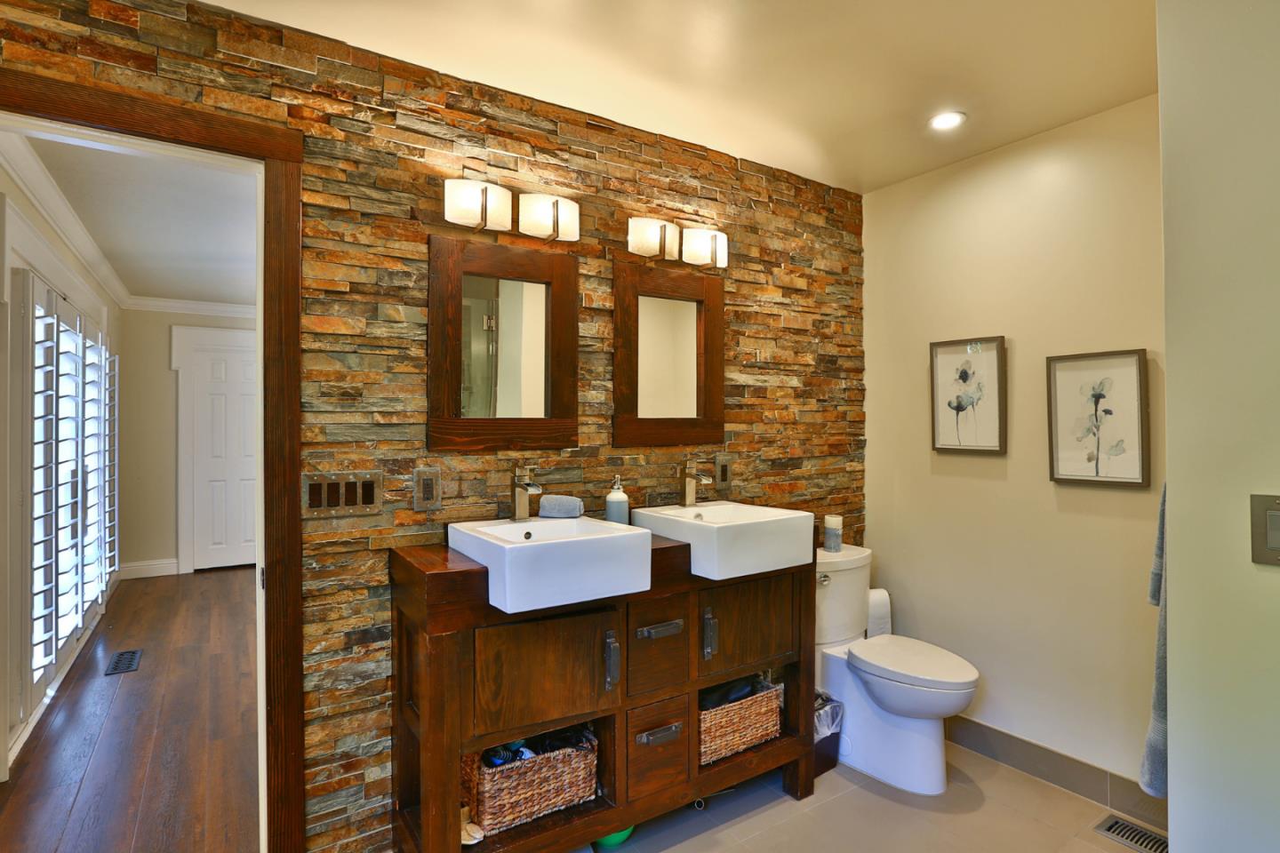 2000 Day Road Gilroy, CA 95020 - Photo 19 of 51 a bathroom with a sink mirror and toilet
