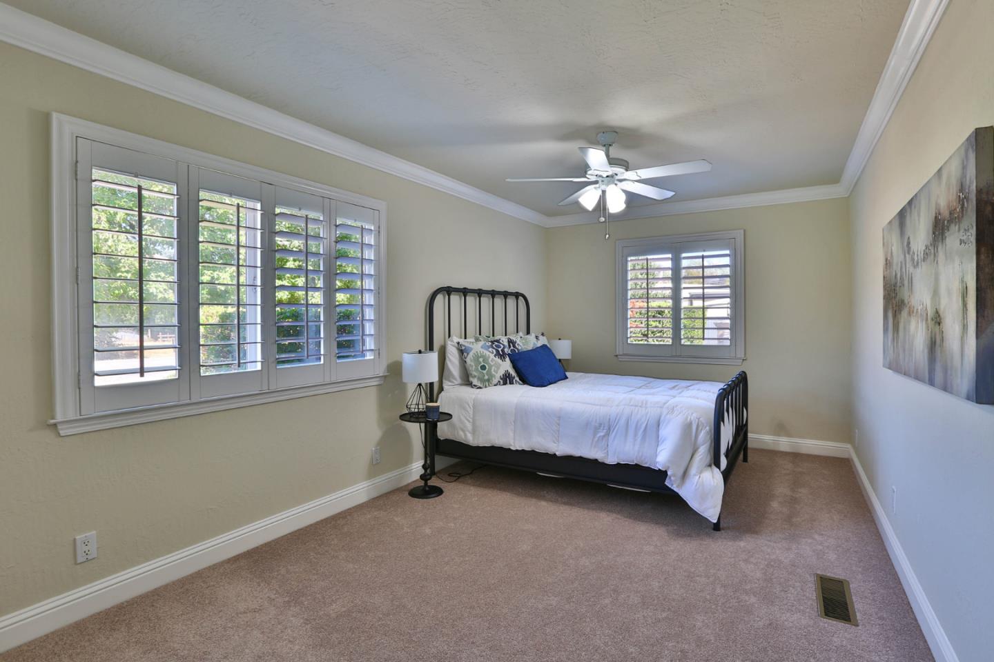 2000 Day Road Gilroy, CA 95020 - Photo 20 of 51 a bedroom with a bed and a chandelier
