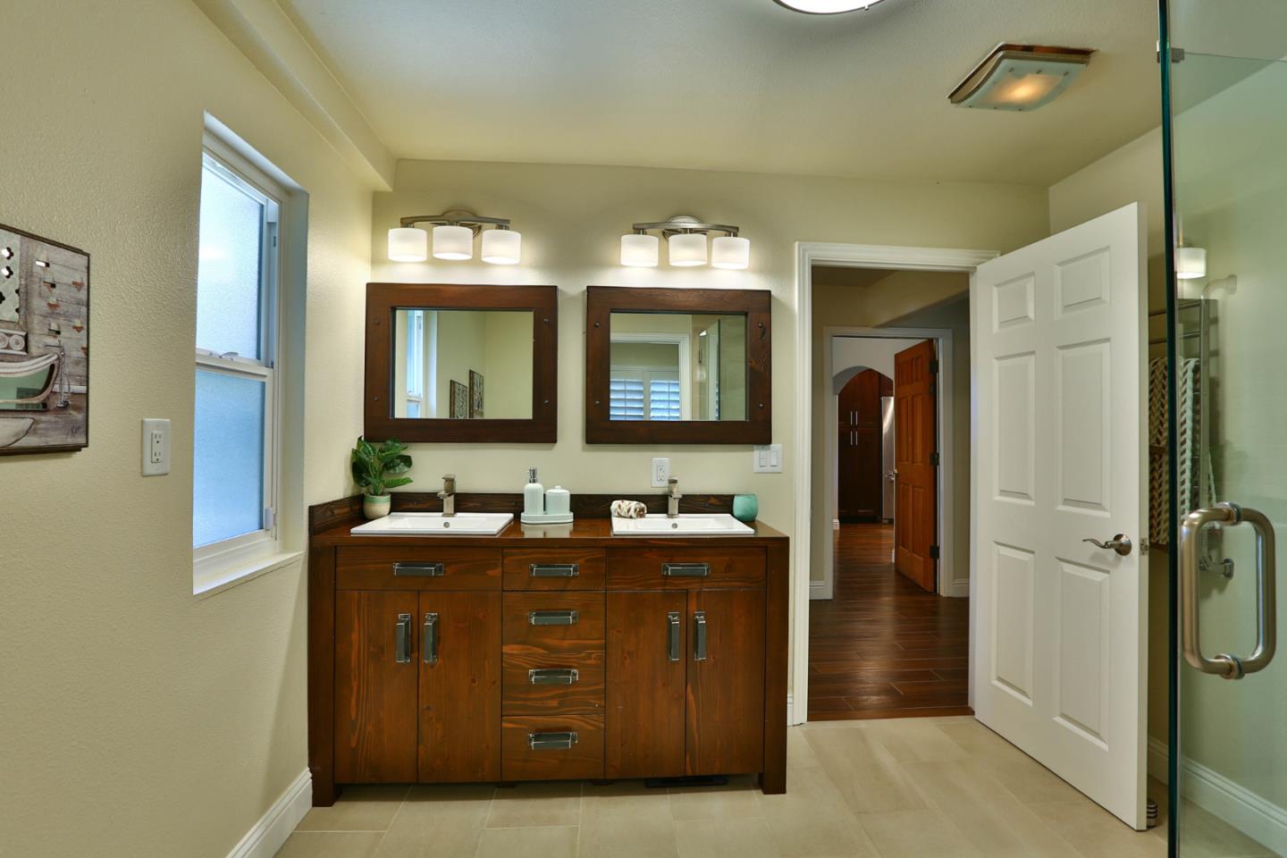 2000 Day Road Gilroy, CA 95020 - Photo 23 of 51 a bathroom with a toilet sink and mirror