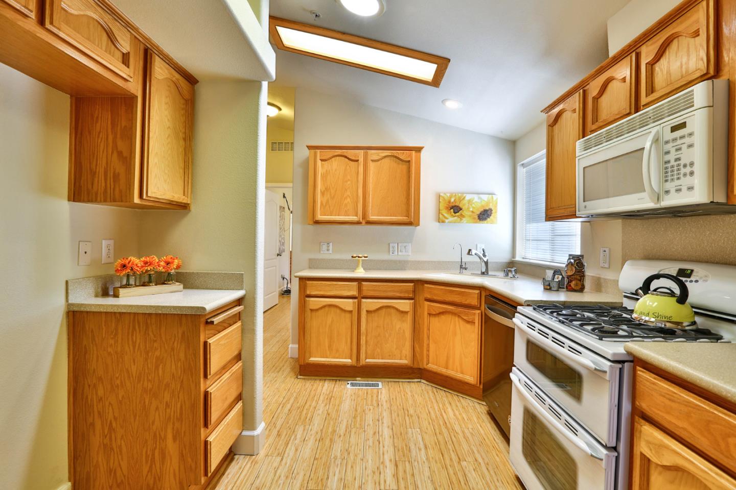 2000 Day Road Gilroy, CA 95020 - Photo 38 of 51 a kitchen with granite countertop a sink stove and cabinets
