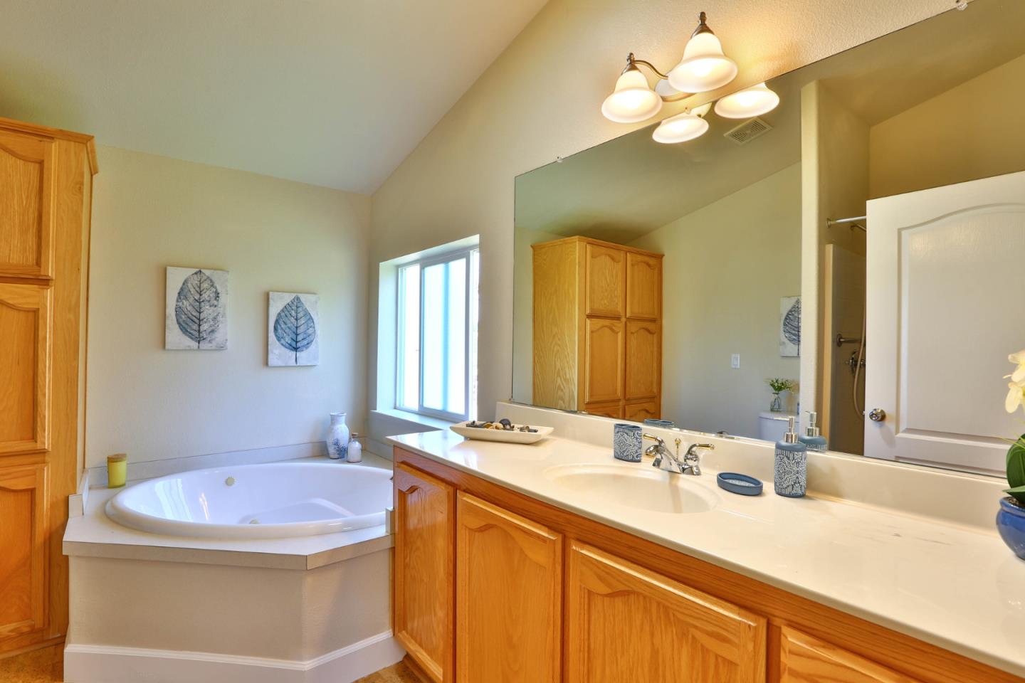 2000 Day Road Gilroy, CA 95020 - Photo 43 of 51 a bathroom with a granite countertop sink a toilet and a mirror