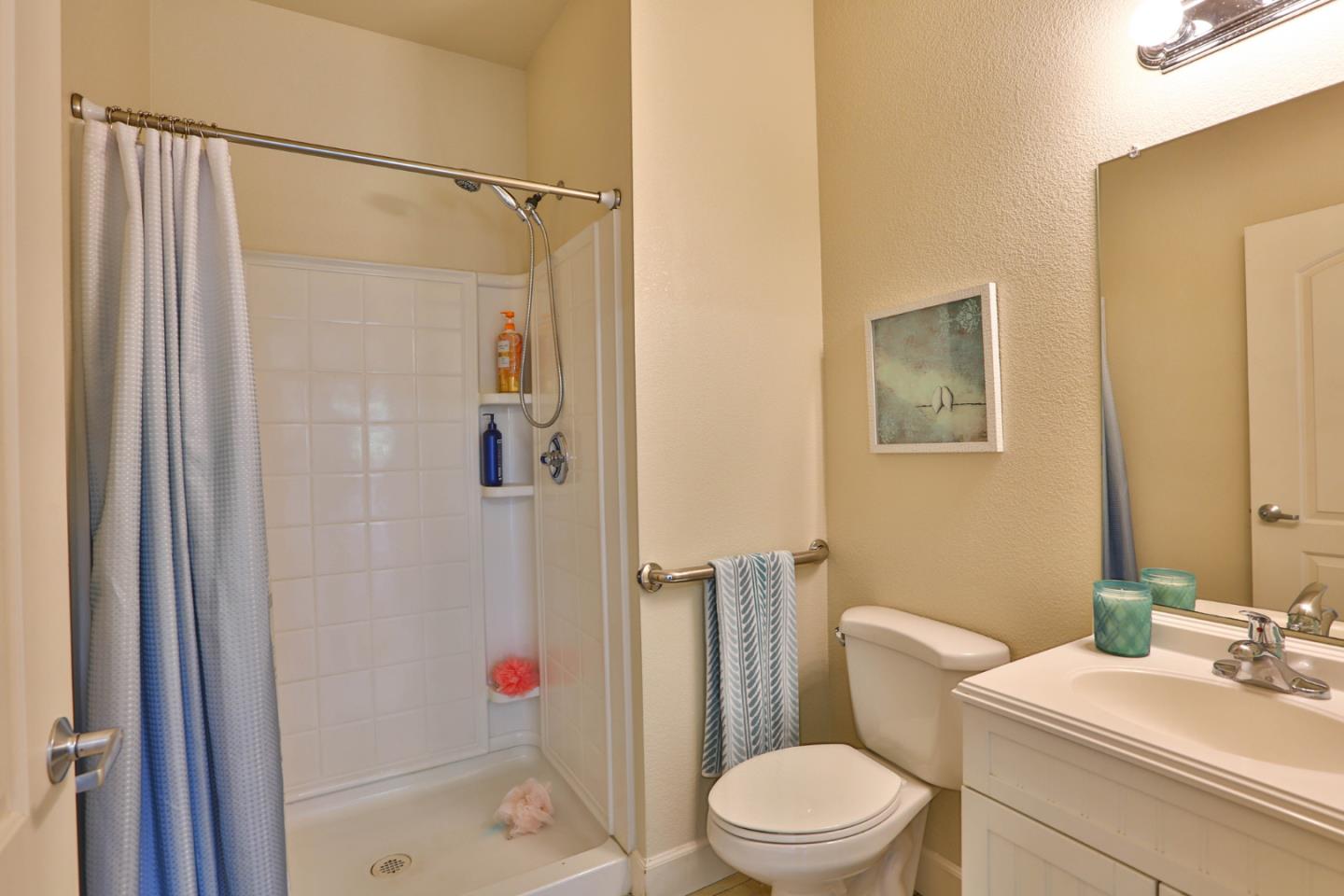 2000 Day Road Gilroy, CA 95020 - Photo 45 of 51 a white toilet sitting next to a bathroom sink