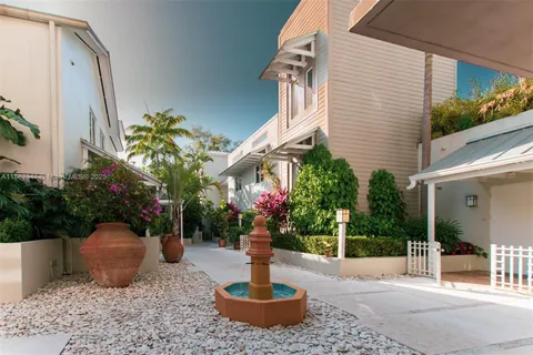 a view of a house with a potted plants