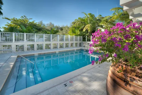 a view of swimming pool from a balcony