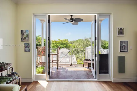 a view of a living room and a floor to ceiling window