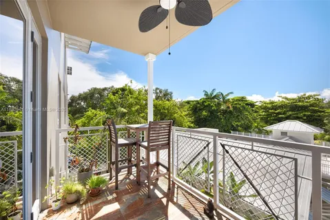 a view of balcony with furniture