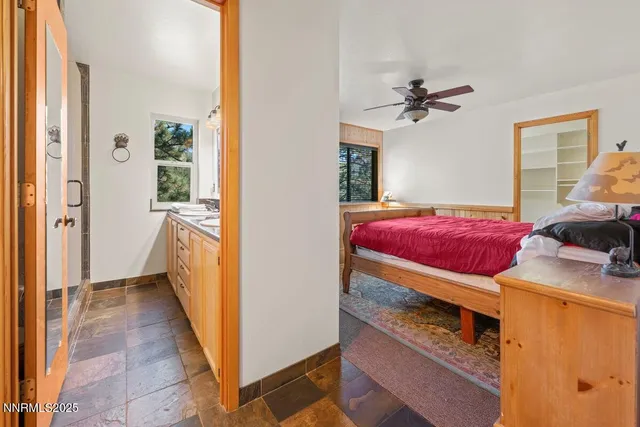 a view of a bedroom with a bed and a hallway