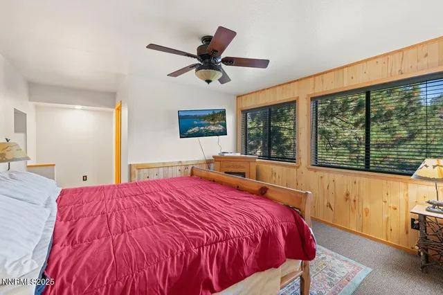 a bed room with a bed and a window