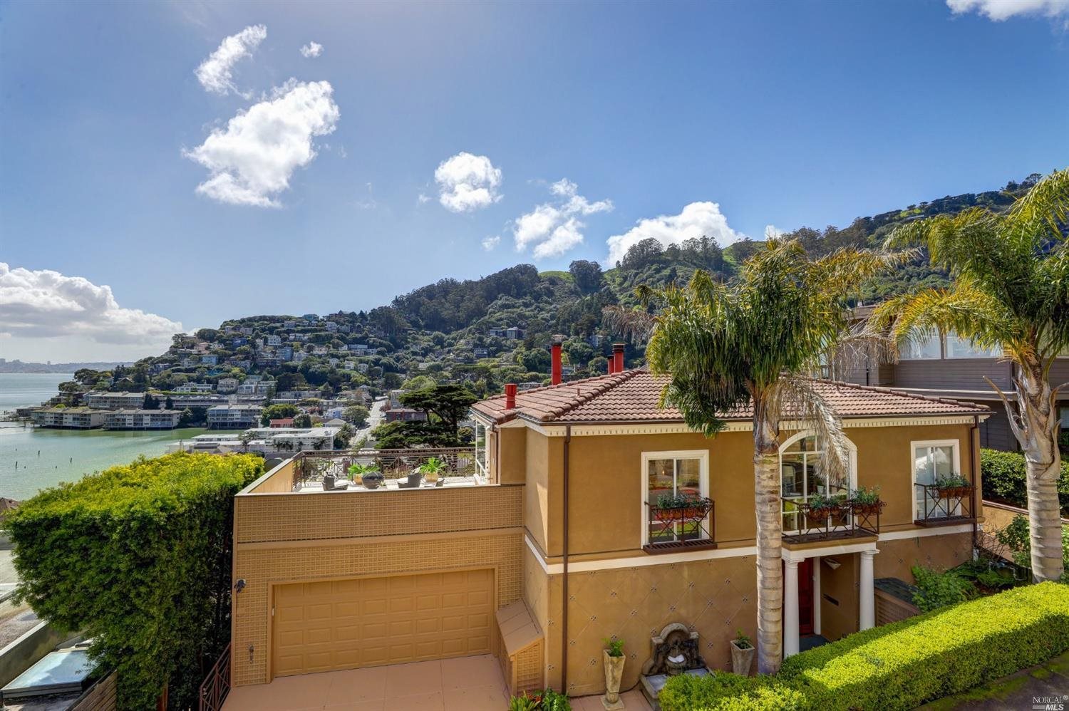 a front view of a residential apartment building with a yard