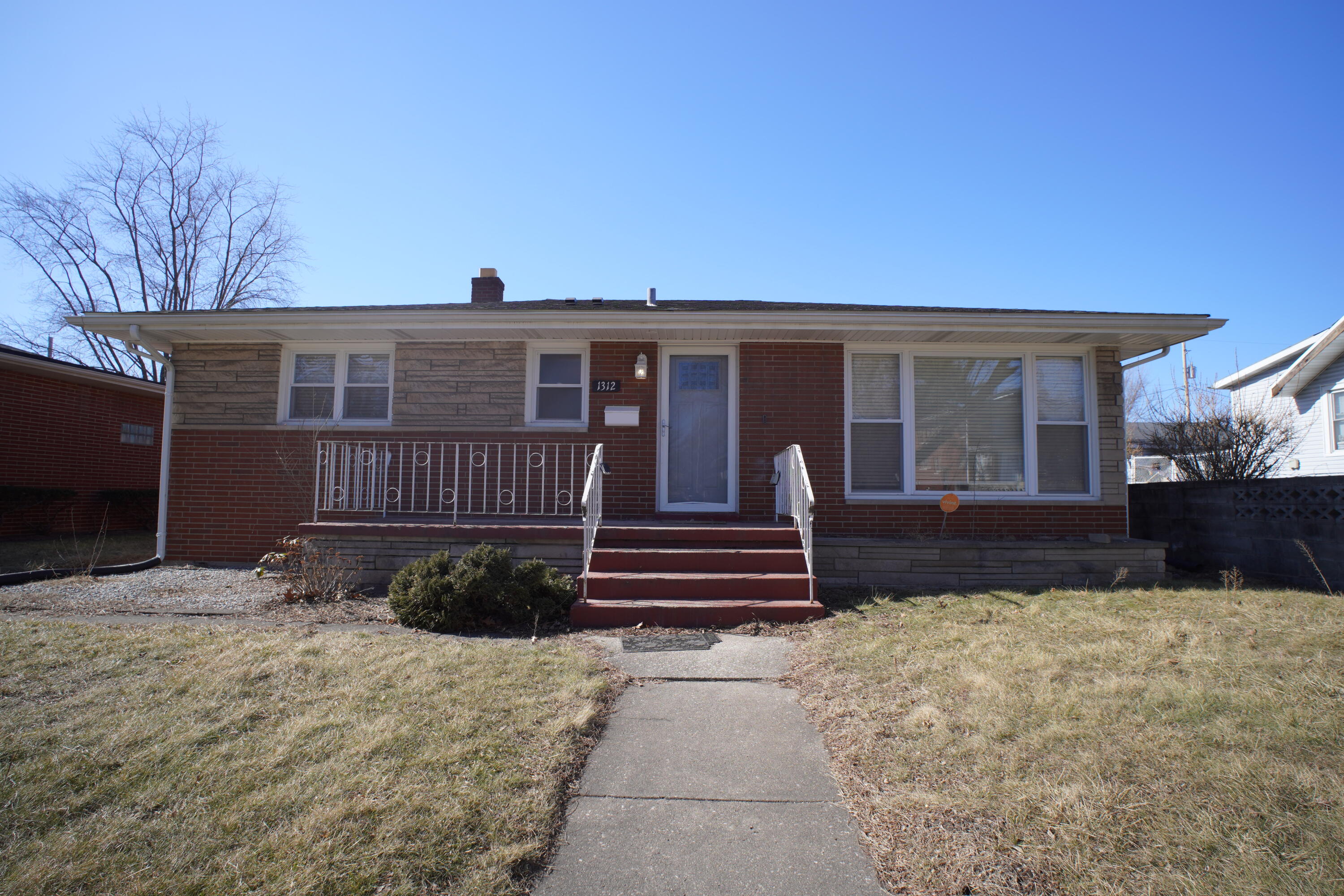1312 Bigger Street Gary, IN 46404 - Photo 1 of 33 a view of a house with a wooden fence