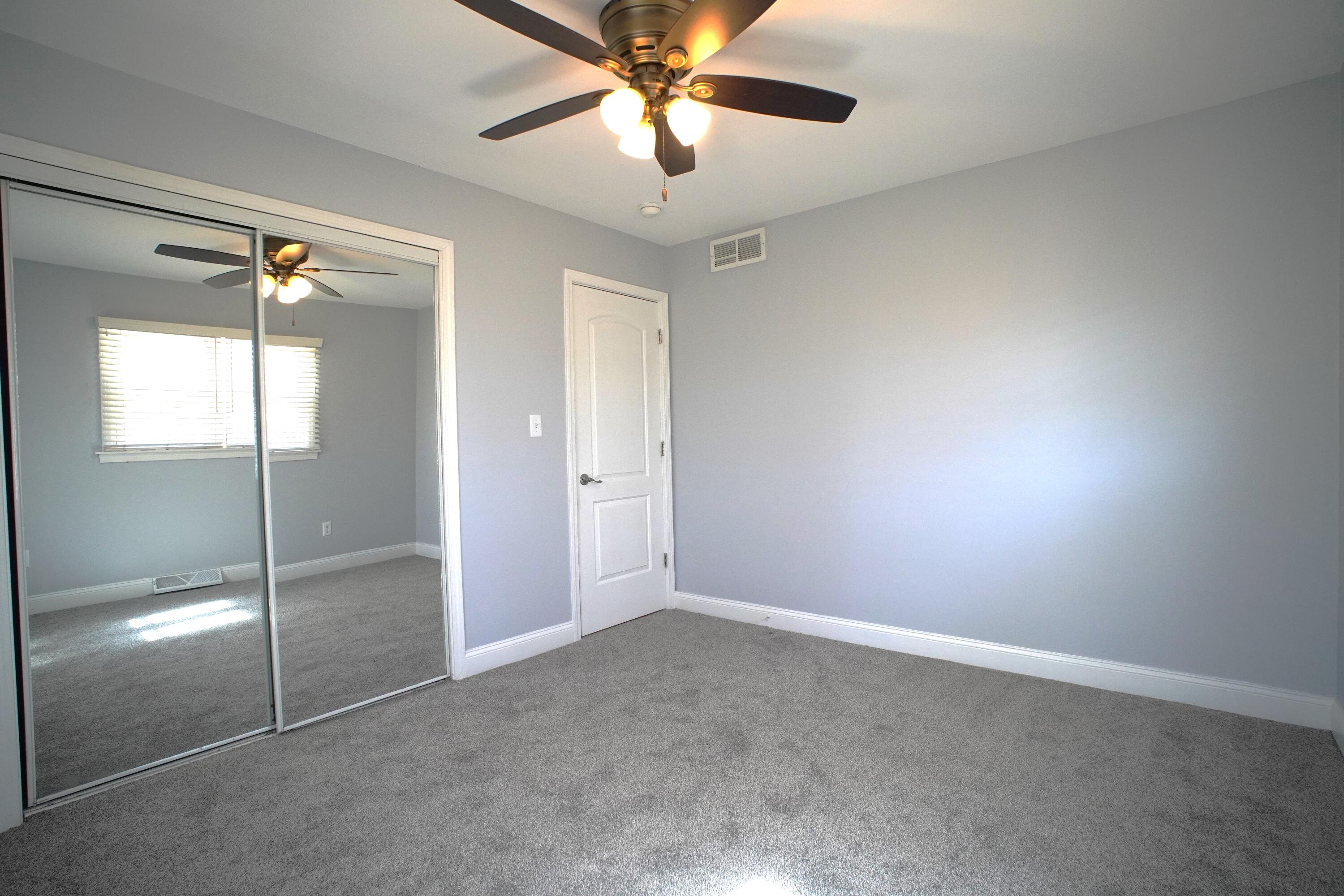 1312 Bigger Street Gary, IN 46404 - Photo 19 of 33 a view of an empty room and a fan
