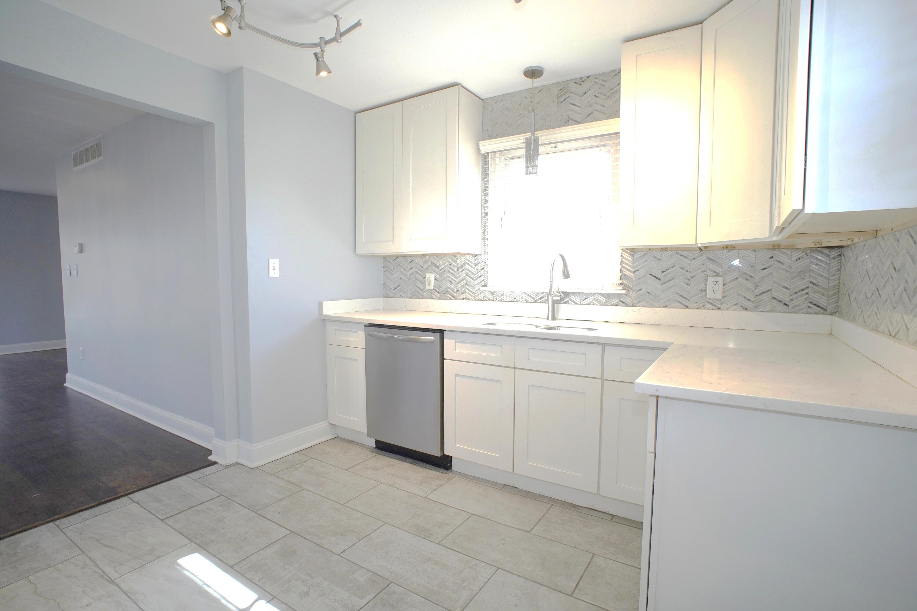 1312 Bigger Street Gary, IN 46404 - Photo 26 of 33 a kitchen with a sink cabinets and window