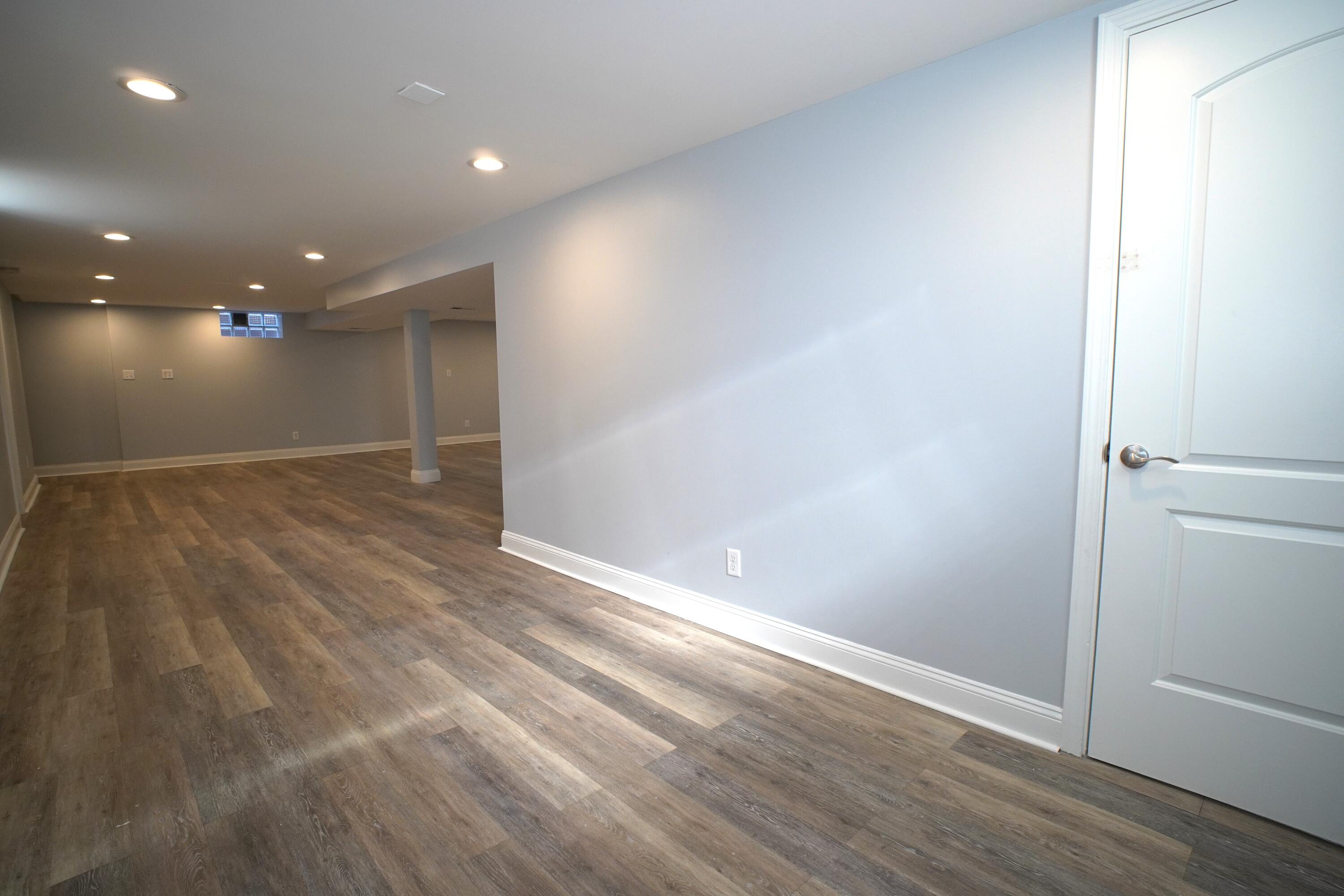 1312 Bigger Street Gary, IN 46404 - Photo 30 of 33 an empty room with wooden floor and entrance