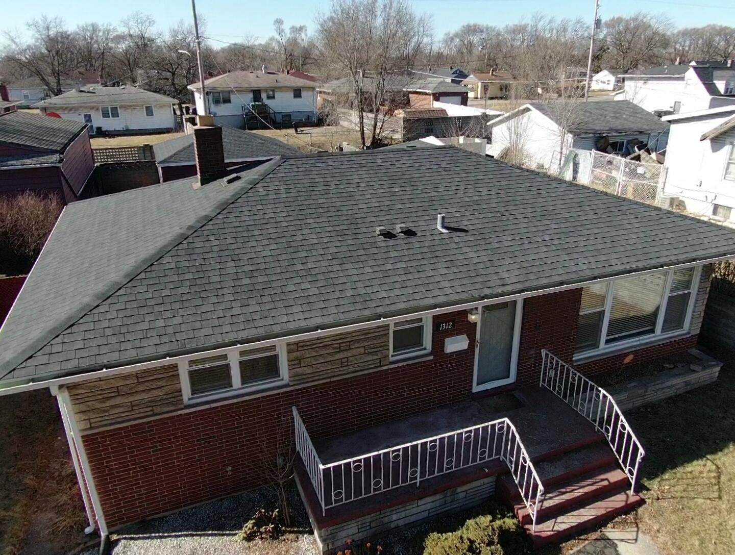 1312 Bigger Street Gary, IN 46404 - Photo 4 of 33 a view of a roof deck with table and chairs