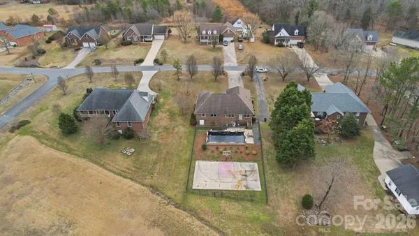 an aerial view of a house with outdoor space