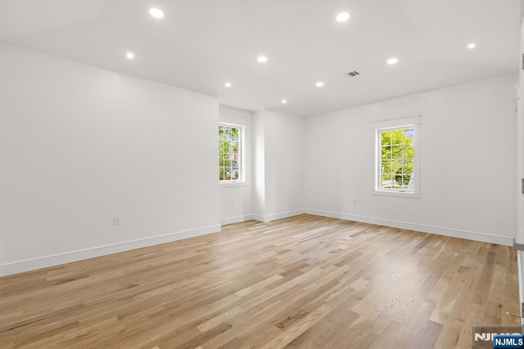 14 Beechwood Road Ho-Ho-Kus, NJ 07423 - Photo 17 of 31 a view of an empty room with window and wooden floor