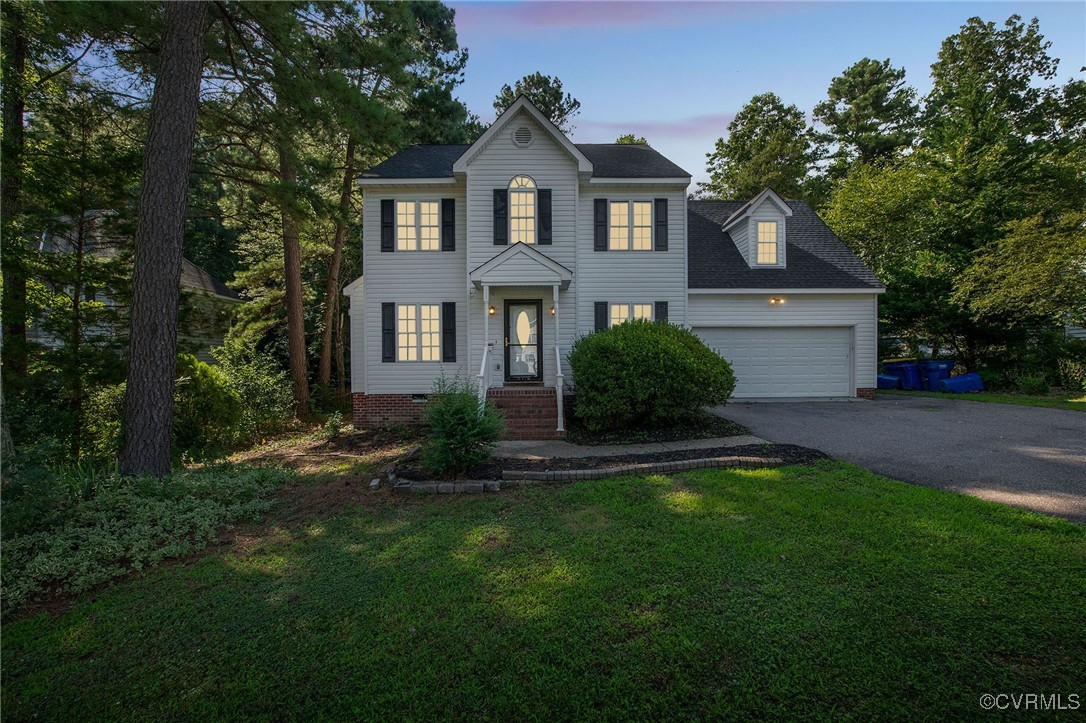12004 Taplow Road Midlothian, VA 23112 - Photo 1 of 32 a front view of a house with a yard and garage